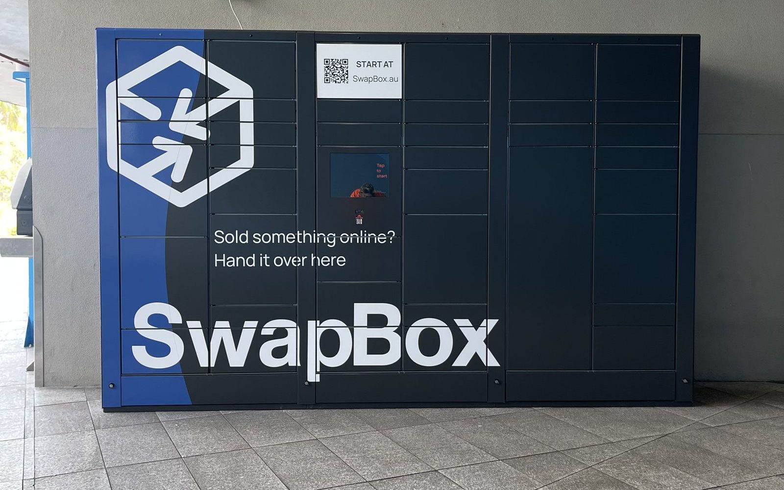 The SwapBox locker, showing the screen and the code scanner